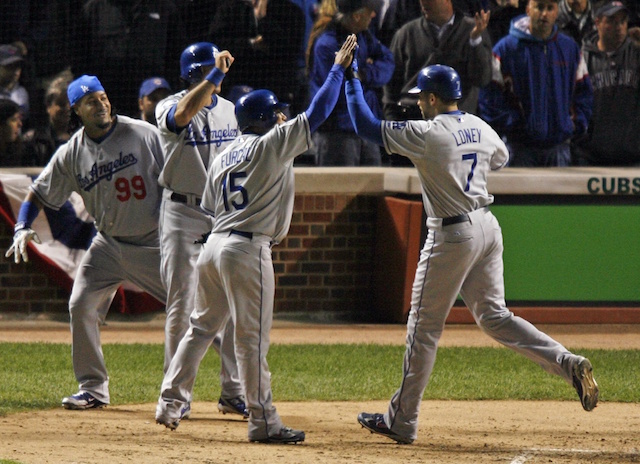 Los Angeles Dodgers left fielder Manny Ramirez tosses his glove