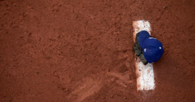 View of a Los Angeles Dodgers cap on the mound in the bullpen at Dodger Stadium