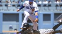 Los Angeles Dodgers infielder Max Muncy fields a throw to second base