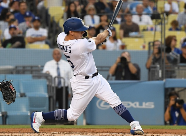 Los Angeles Dodgers catcher Austin Barnes hits a double against the Arizona Diamondbacks