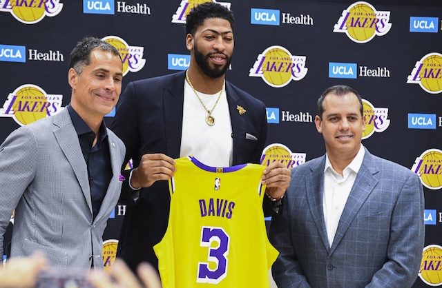 Los Angeles Lakers general manager Rob Pelinka and head coach Frank Vogel with Anthony Davis during his introductory press conference