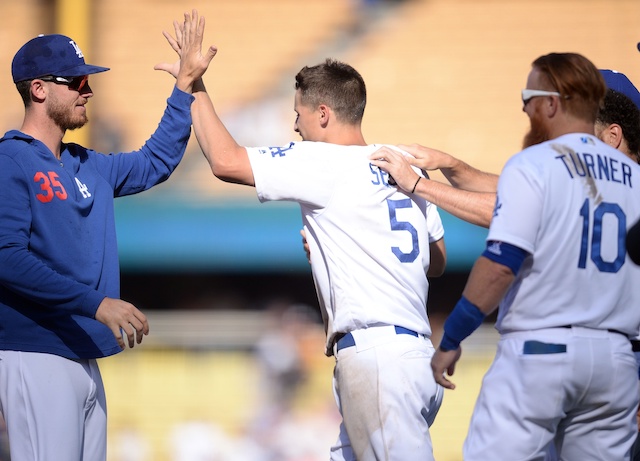 Cody Bellinger, Corey Seager and Justin Turner celebrate after a Los Angeles Dodgers walk-off win