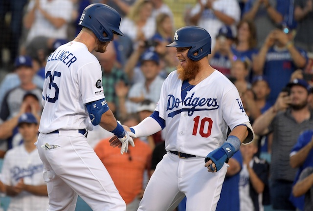 Los Angeles Dodgers teammates Cody Bellinger and Justin Turner celebrate after a home run