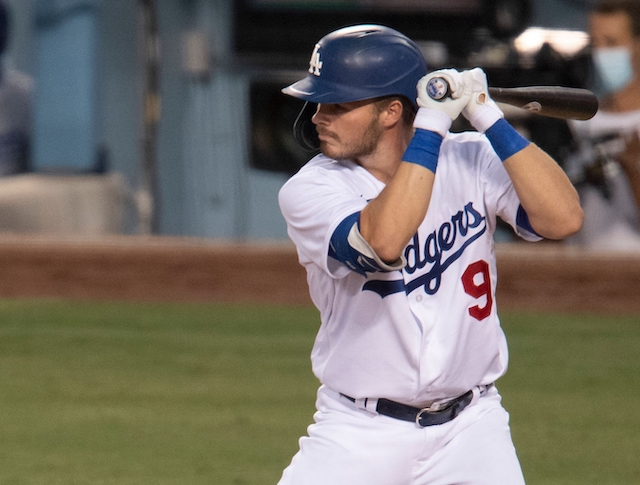 Gavin Lux of the Los Angeles Dodgers looks on from the dugout